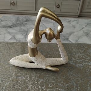 Elegant Gold and Cream Yoga Pose Sculpture